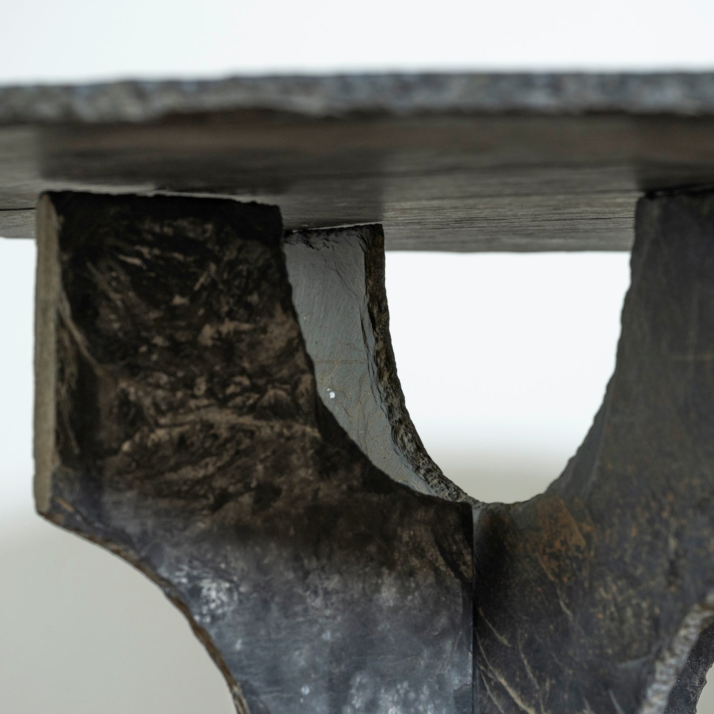 Close-up of a stone bench with a white background