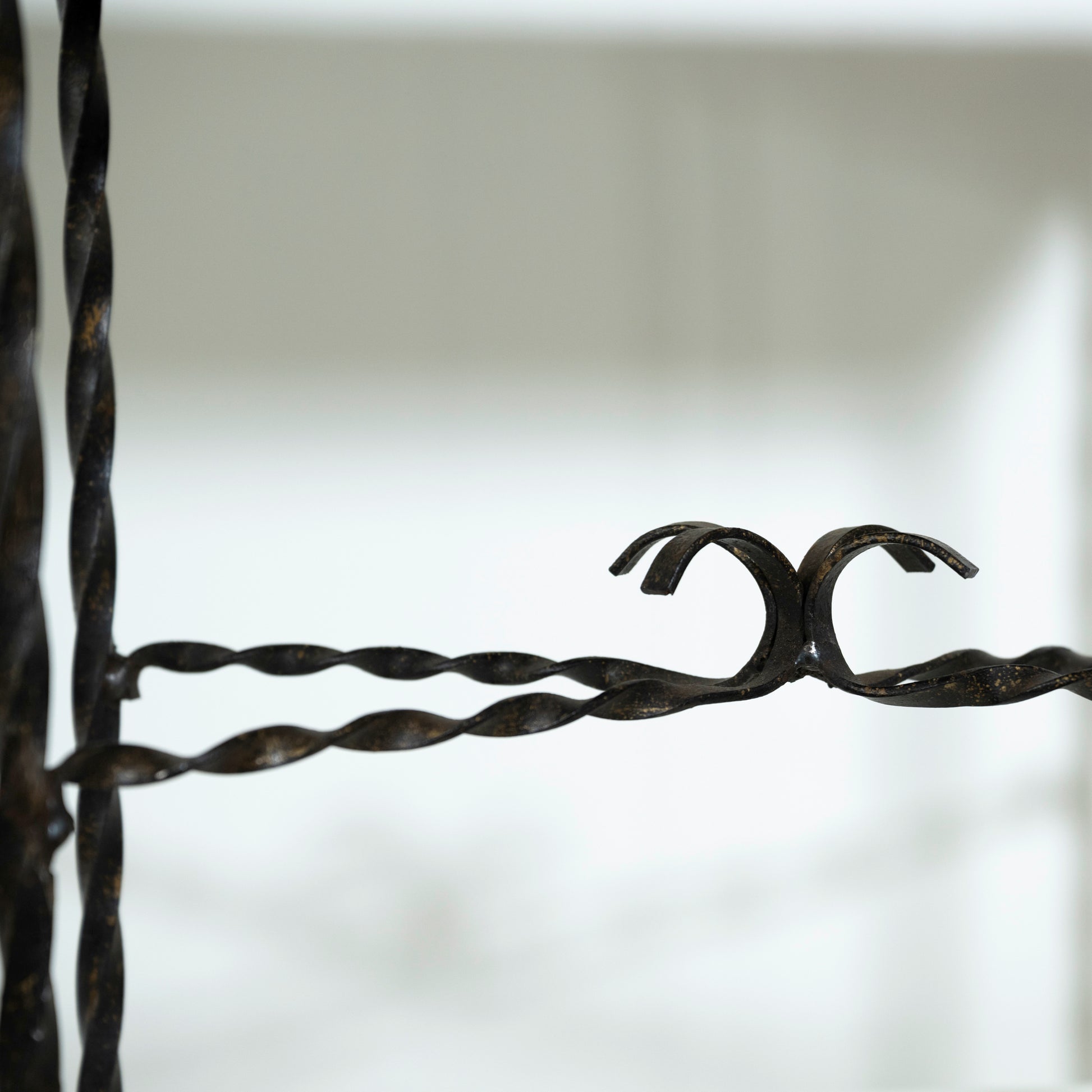 Close-up of barbed wire against a blurred background