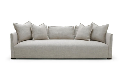 Beige linen-textured Thibaut Flax Linen slipcovered sofa 96 inch with modern minimalist design and matching throw pillows