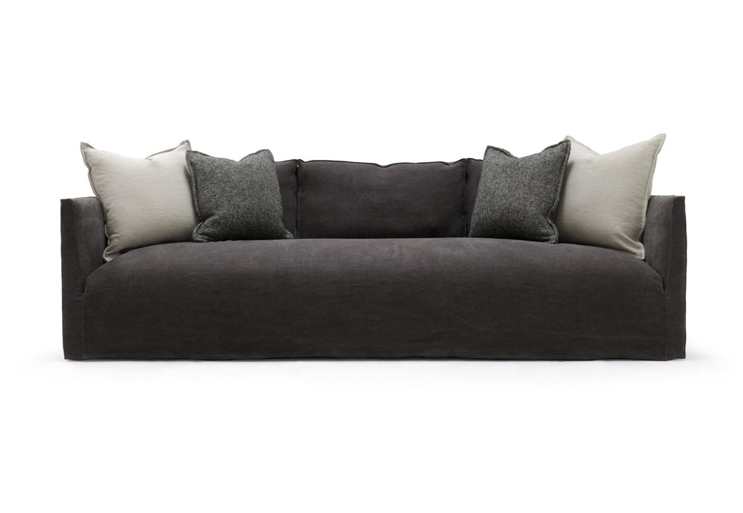 Dark gray upholstered Thibaut Flax Linen slipcovered sofa with modern design and light gray textured throw pillows 96 inches