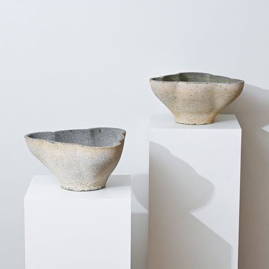 The 19th Century Antique Belgian Trefoil Planter, with its asymmetrical, textured ceramic design in muted earth tones, is displayed on a white pedestal against a plain white background for a minimalist modern look.
