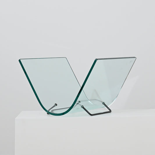 The Vintage Italian Curved Glass Magazine Holder features two V-shaped curved glass panels with a sleek metal stand, displayed on a white surface against a plain background.