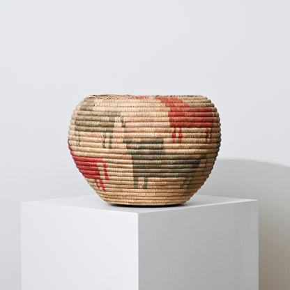 Mid 20th century Native American handwoven basket with rounded shape beige straw and red olive green geometric patterns
