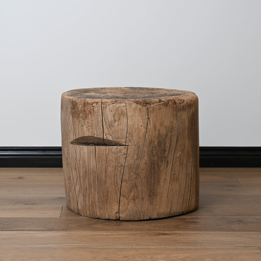 A late 19th century primitive japanese mortar usu table with a rustic cylindrical wooden stool and natural wood finish