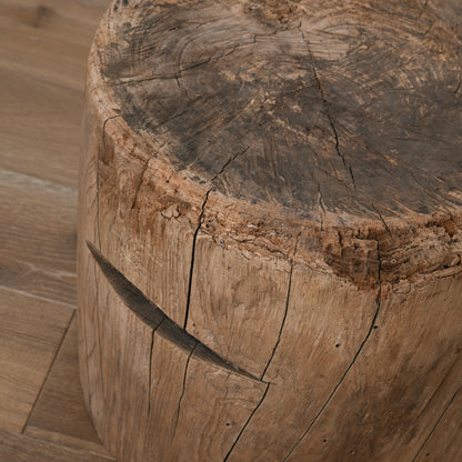 Rustic natural wood tree stump stool with visible grain and cracks part of late 19th century primitive japanese mortar usu table