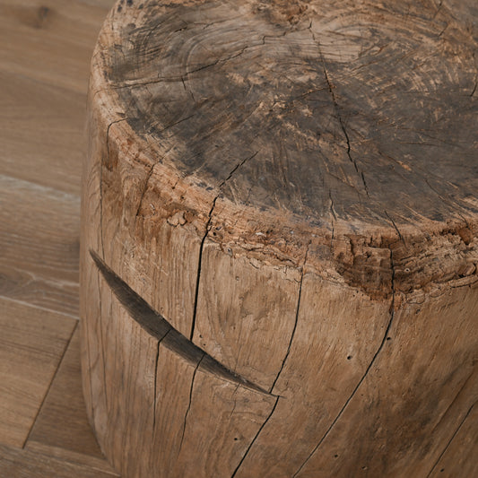 Rustic natural wood tree stump stool with visible grain and cracks part of late 19th century primitive japanese mortar usu table