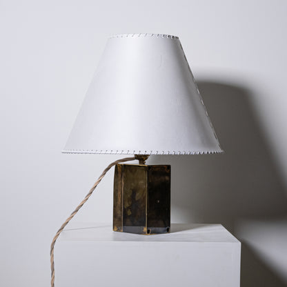 Brass and parchment table lamp with white leather stitched lampshade and brass-finished hexagonal base