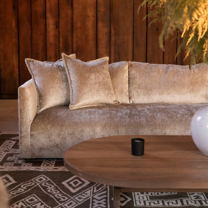 Beige velvet custom order thibaut sofa with matching throw pillows and modern minimalist design