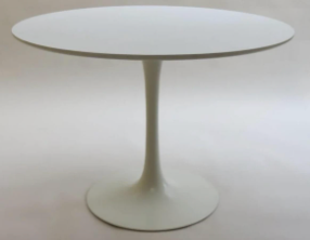 White oval maurice burke tulip table with a sleek minimalist design and single pedestal base
