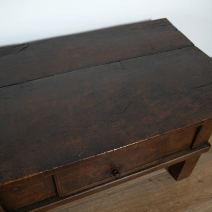 Wooden crate with a dark brown top and lighter sides on a white background