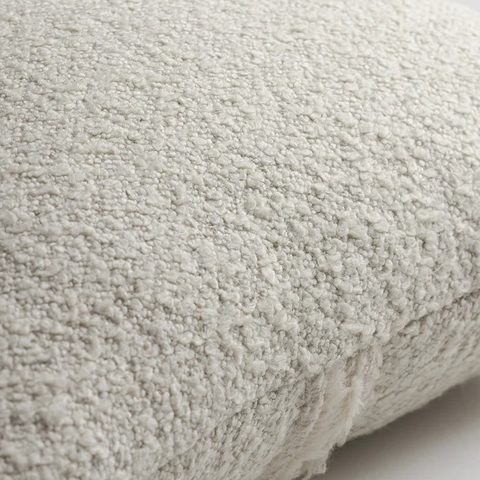 A soft off-white attenborough pillow with a plush fuzzy textured surface and zip detail for easy cleaning