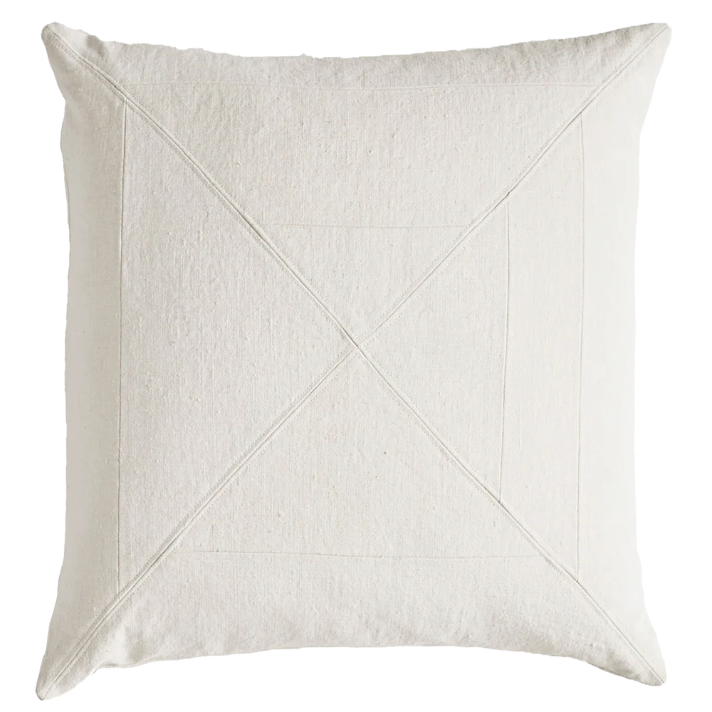 Cream-colored vintage canvas panelled pillow with textured fabric and subtle geometric x stitching pattern