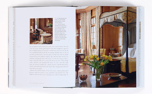 A clear glass vase of bright yellow tulips featured in the private house product collection