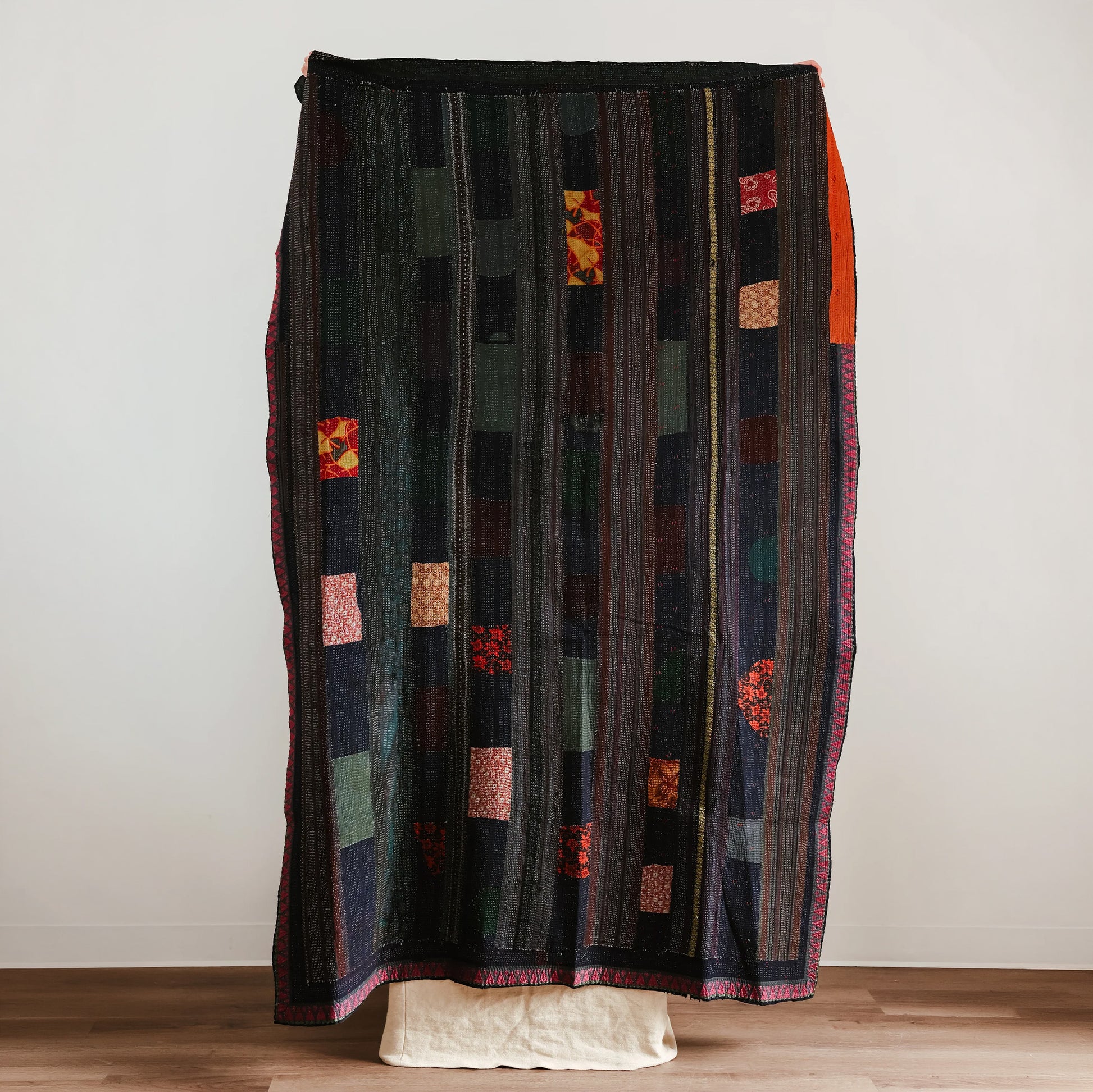 Long, patterned, multicolored quilt