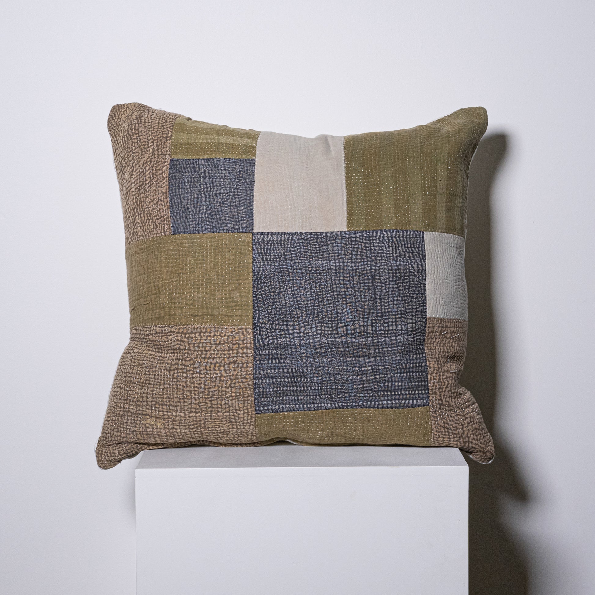 Mosaic pillow earth-toned patchwork cushion with textured fabric squares in olive beige and gray hues