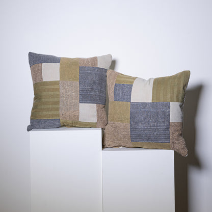 Two mosaic pillows with rectangular patchwork design in olive green beige and muted blue woven fabric