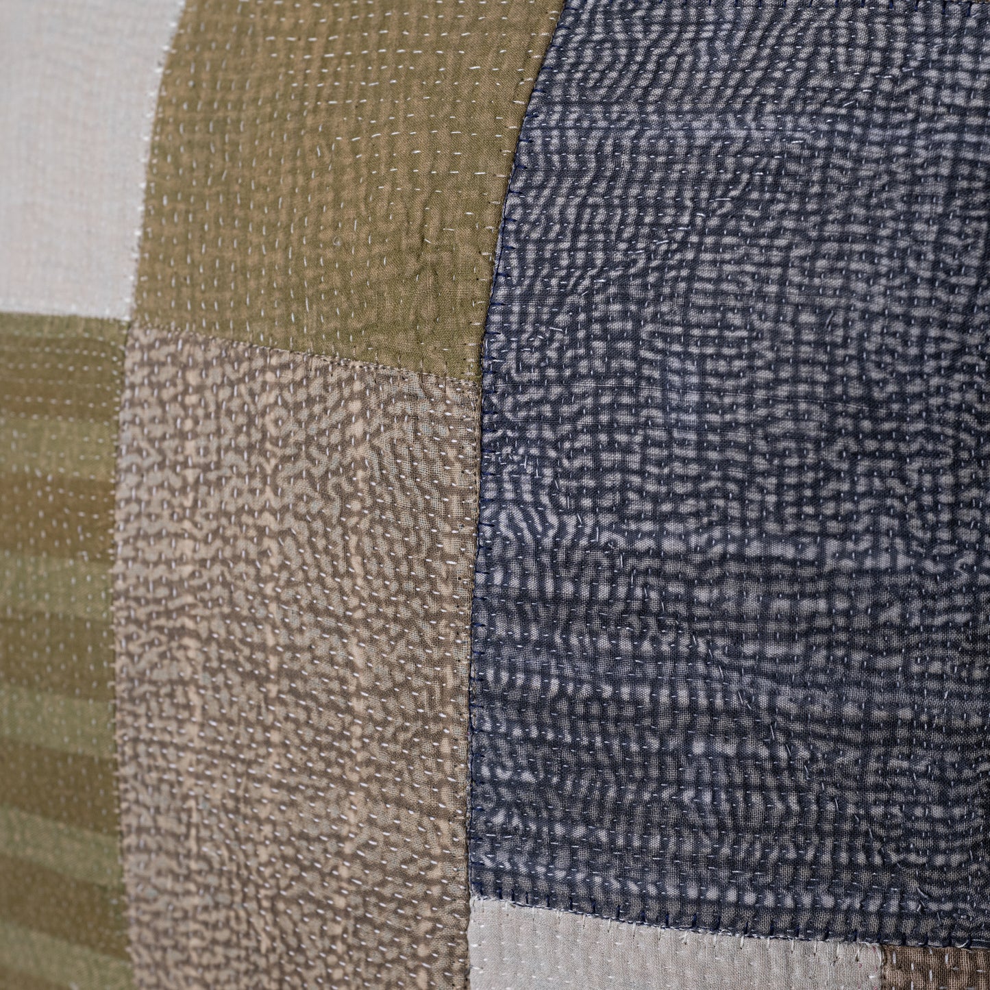 Mosaic pillow patchwork quilt with textured fabrics in olive green beige navy blue and cream for cozy decor