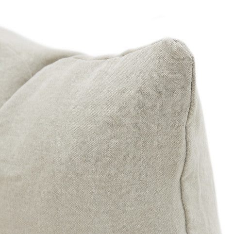 Beige linen pillow with a soft, textured surface and neatly stitched edges.