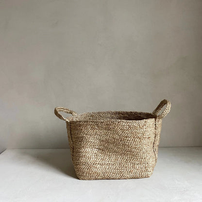 Hand woven jute basket natural fiber woven storage basket with two sturdy handles in beige and brown tones
