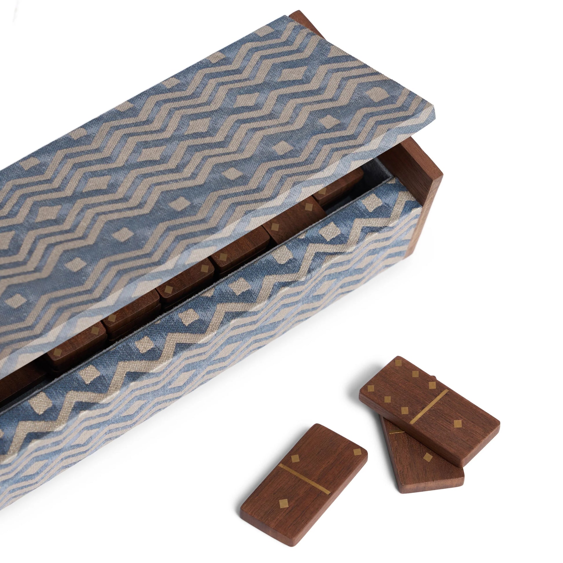 Fortuny dominoes set with blue and beige zigzag fabric-covered wooden box and matching brown wood dominoes with gold inlays