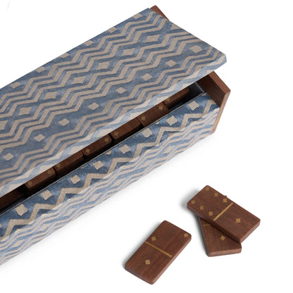 Fortuny dominoes set with blue and beige zigzag fabric-covered wooden box and matching brown wood dominoes with gold inlays