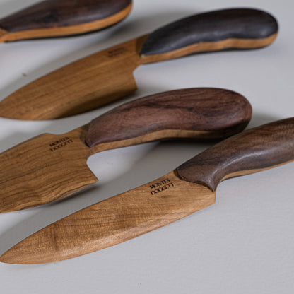 Handcrafted teak and sono wooden kitchen knives with dark and light wood handles engraved montes doggett branding